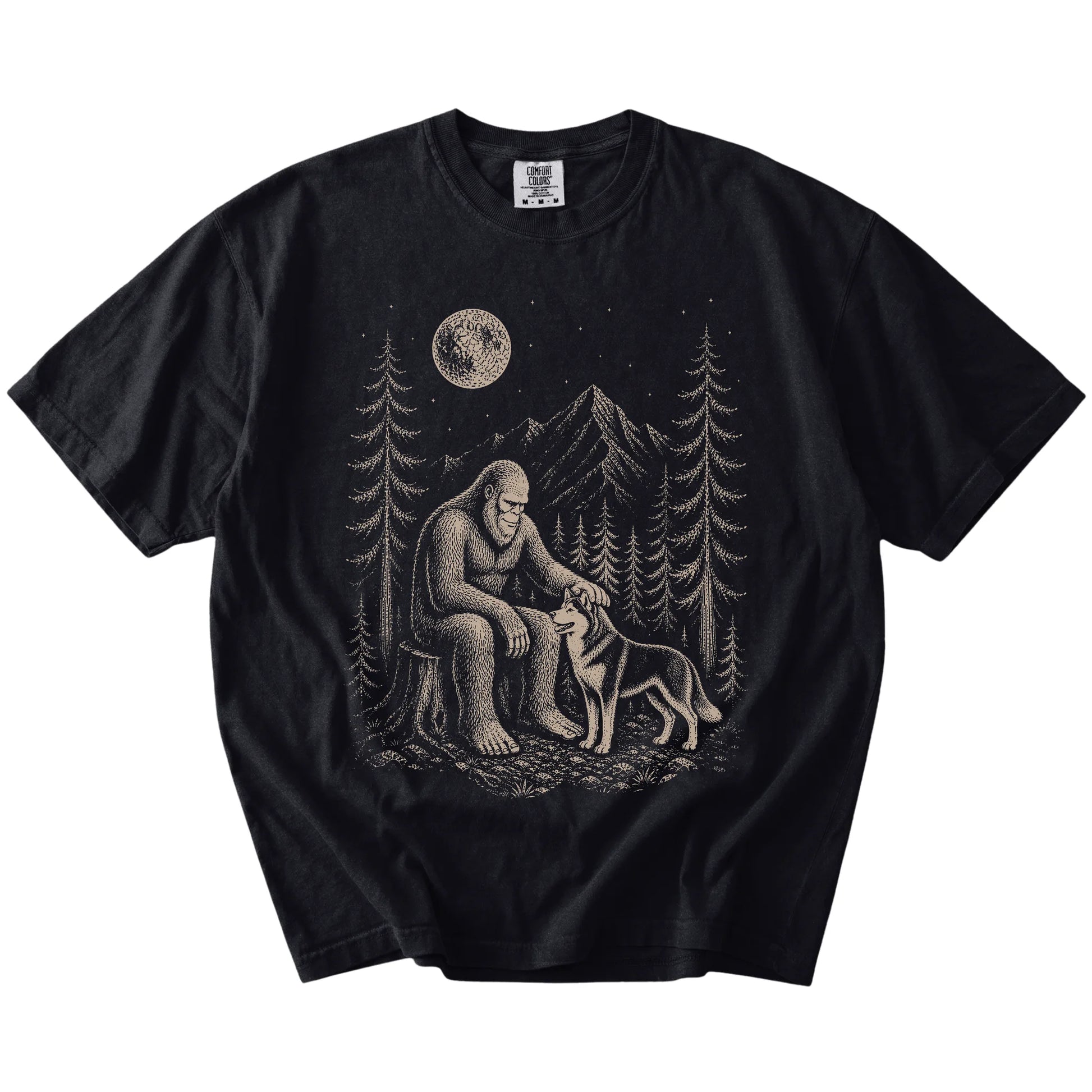 Bigfoot petting a Husky beneath the moon in a pine forest on a Black Comfort Colors® T-shirt