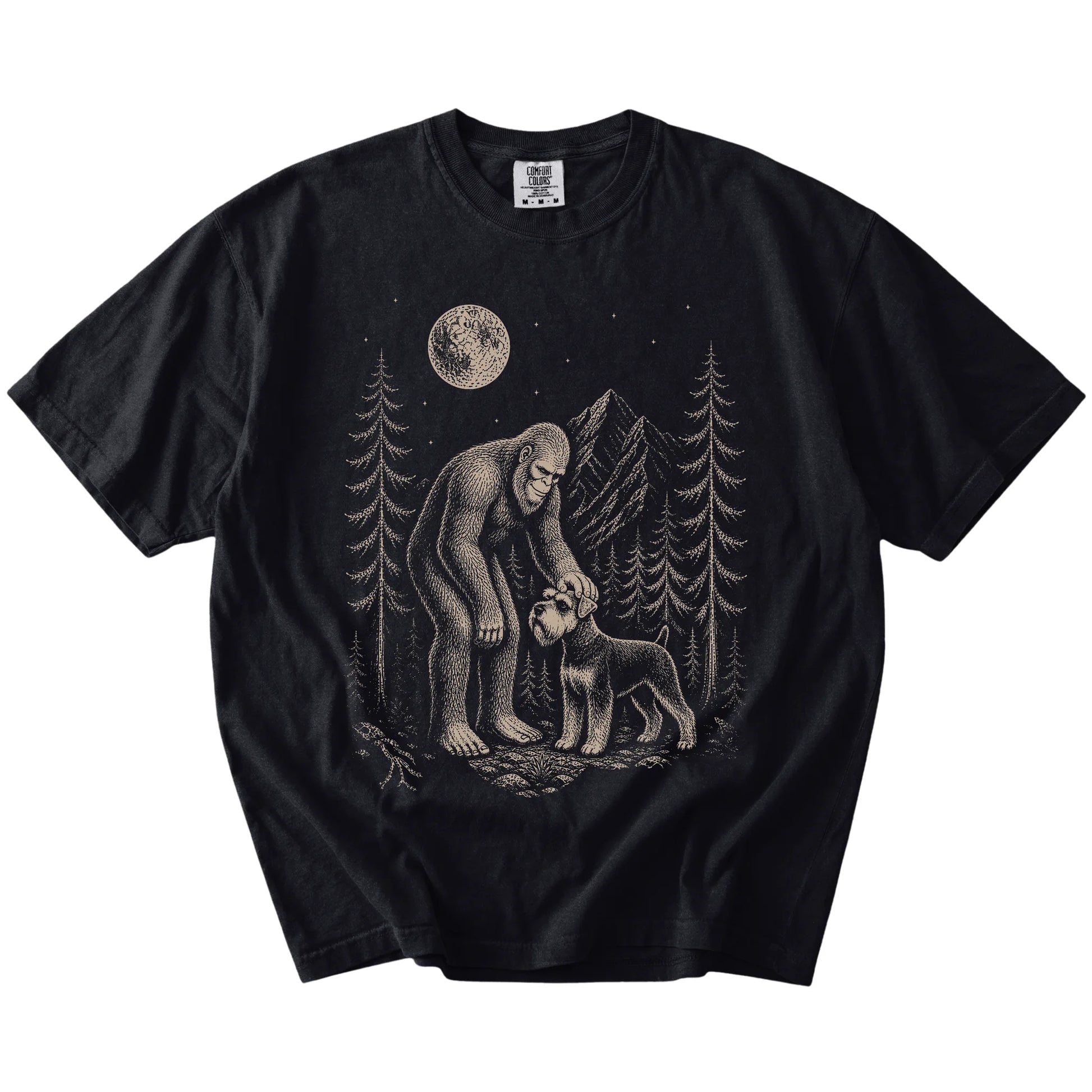 Bigfoot petting a Schnauzer beneath the moon in a pine forest on a Black Comfort Colors® T-shirt