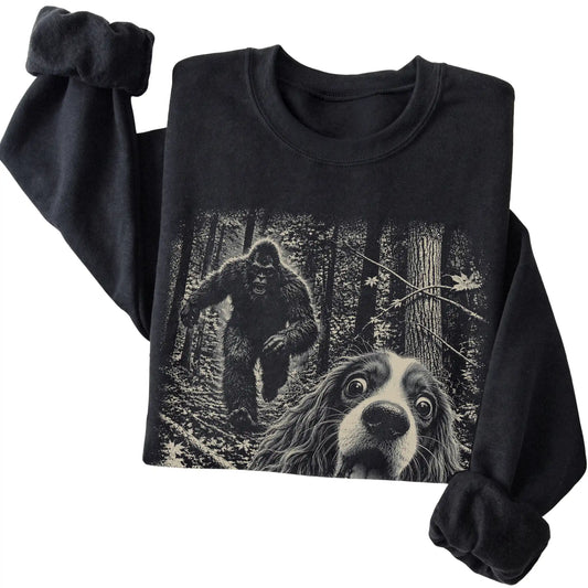 Black Cavalier King Charles Spaniel Bigfoot selfie sweatshirt, close-up view