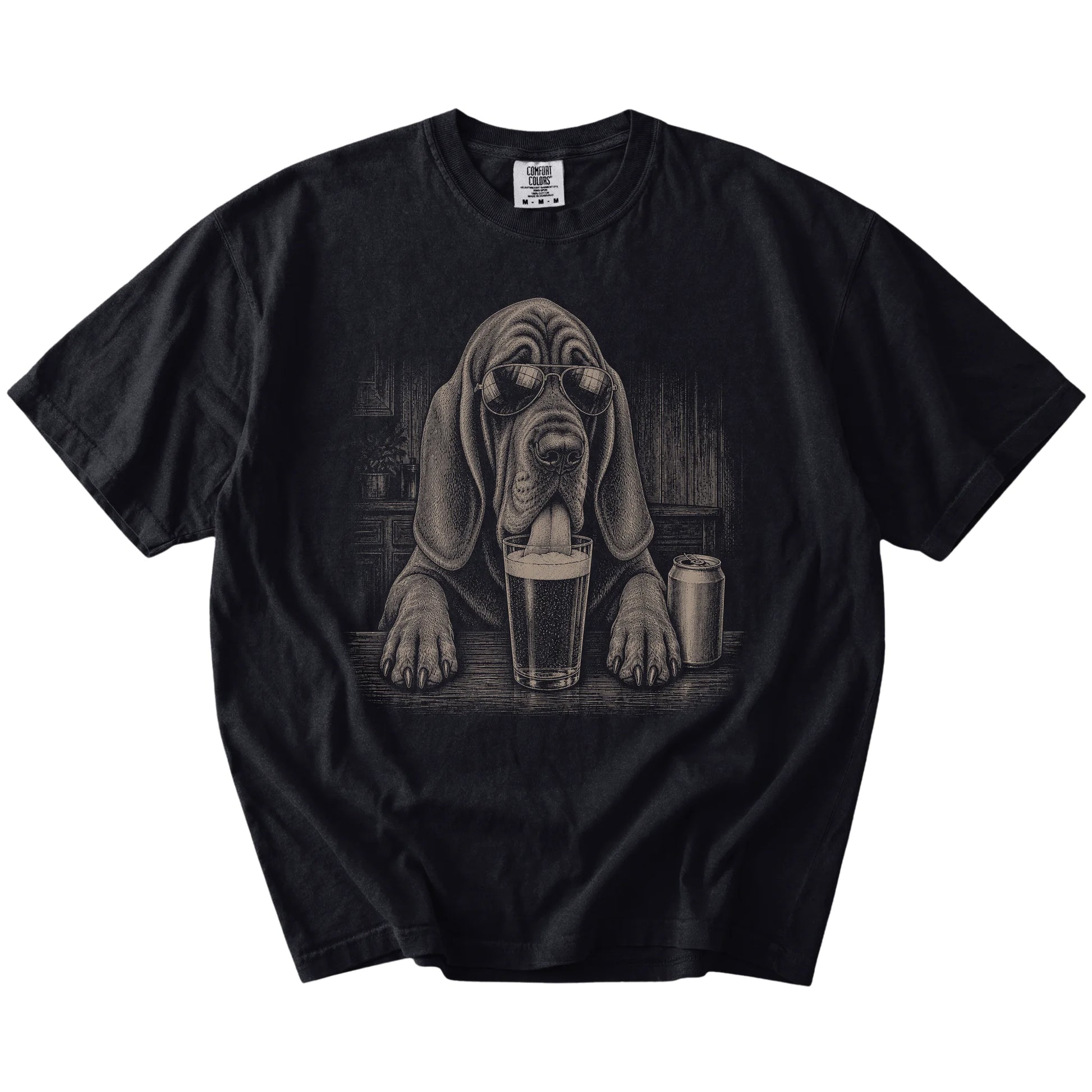 Bloodhound sneaking a drink from a foamy pint at home on a Black Comfort Colors® t-shirt