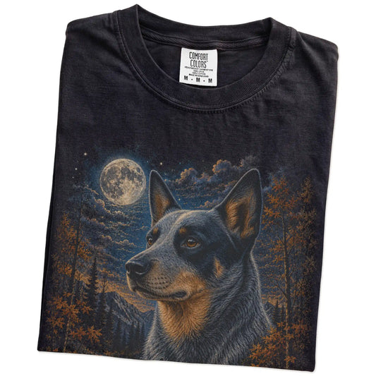 Folded Black Comfort Colors® t-shirt showing Blue Heeler in a fall forest graphic