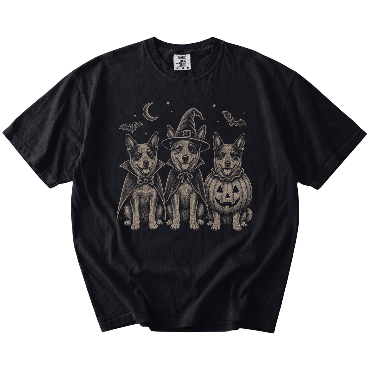 Three Blue Heeler dogs dressed for Halloween beneath bats and a crescent moon on a Black Comfort Colors® T-shirt