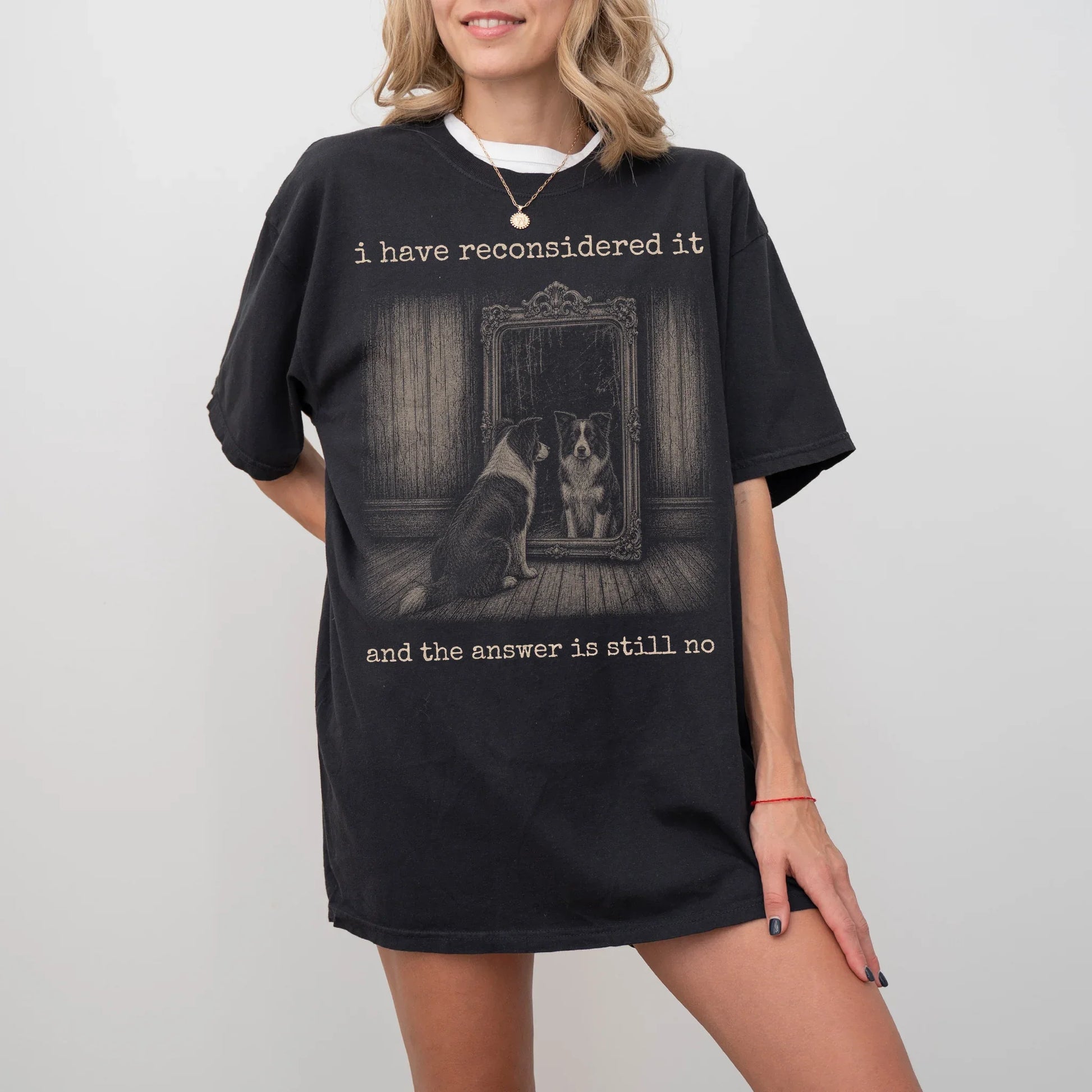 Model wearing a Black Comfort Colors® T-shirt with “the answer is still no” border collie design