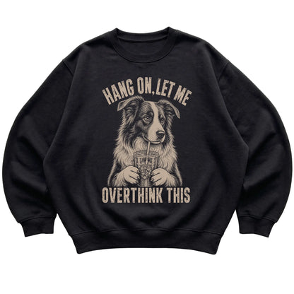 Black crewneck sweatshirt featuring Overthinking Border Collie, laid-flat presentation
