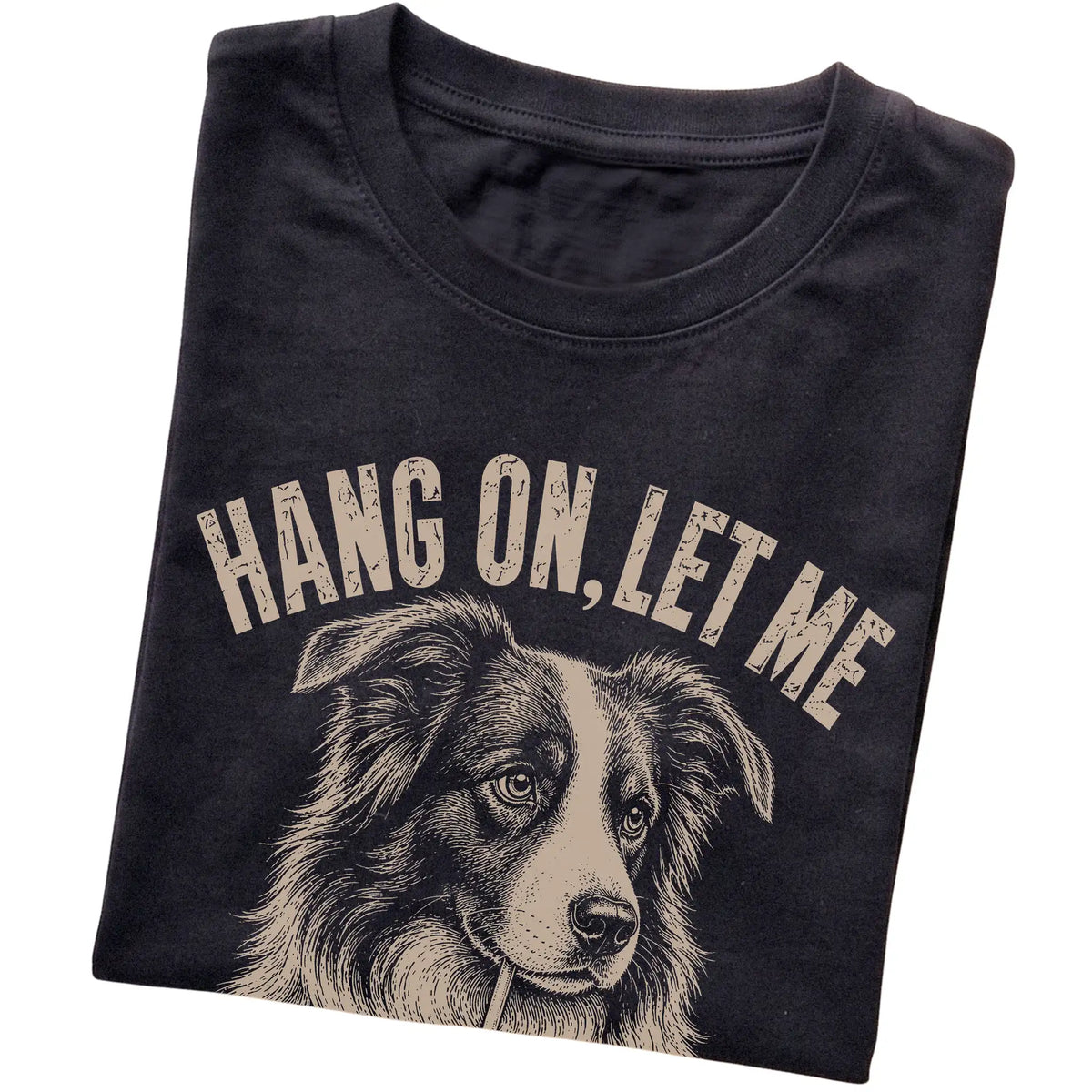 Black T-shirt featuring Overthinking Border Collie, folded presentation