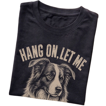 Black T-shirt featuring Overthinking Border Collie, folded presentation