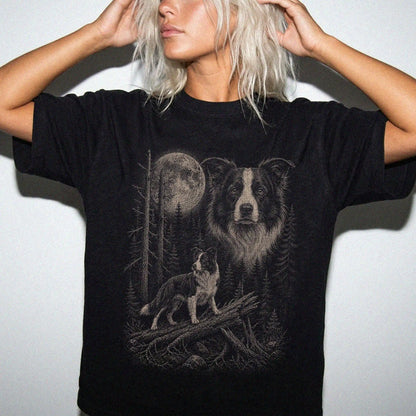Woman wearing a Black Border Collie Moonlit Forest T-Shirt