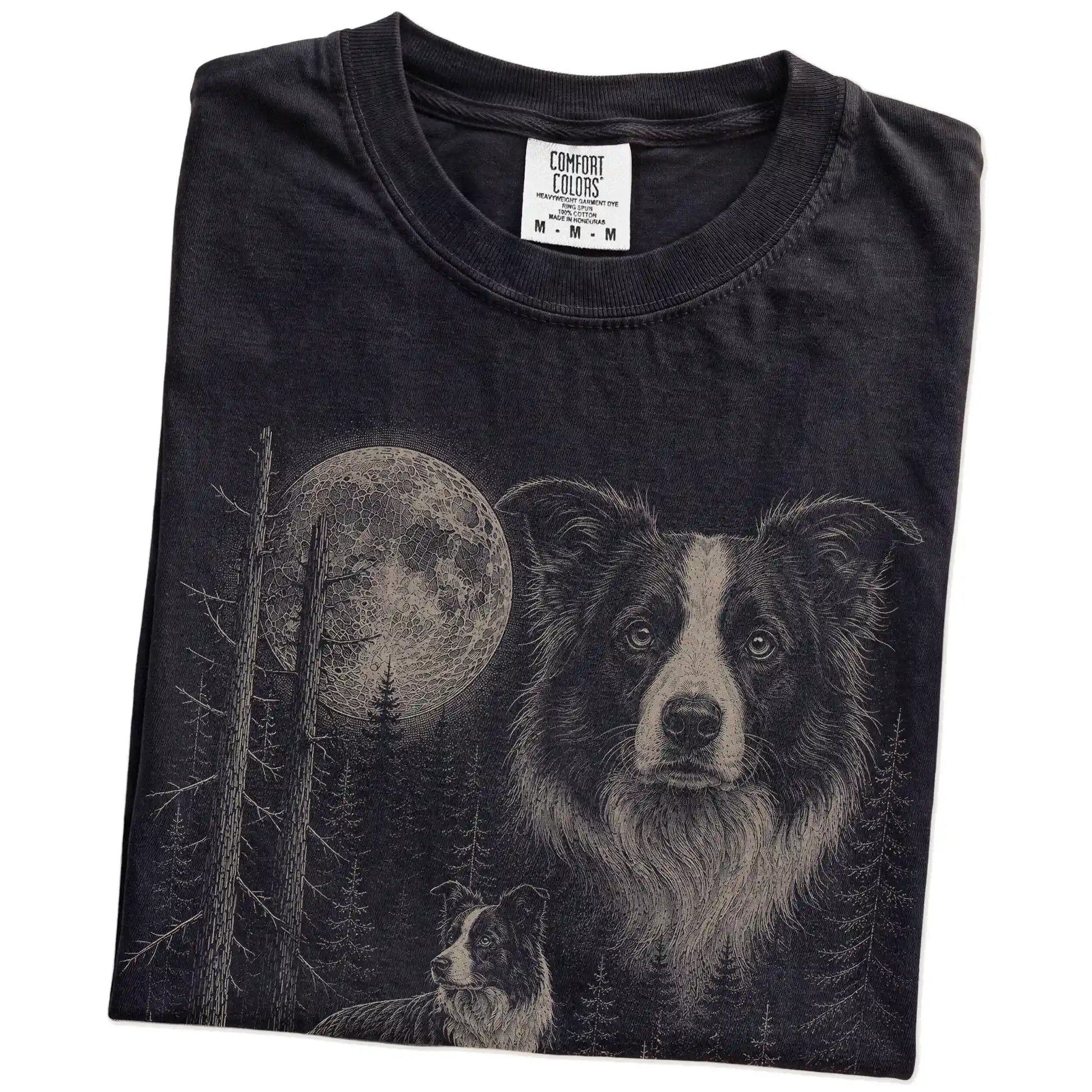 Folded Black Border Collie Moonlit Forest T-Shirt showing the graphic