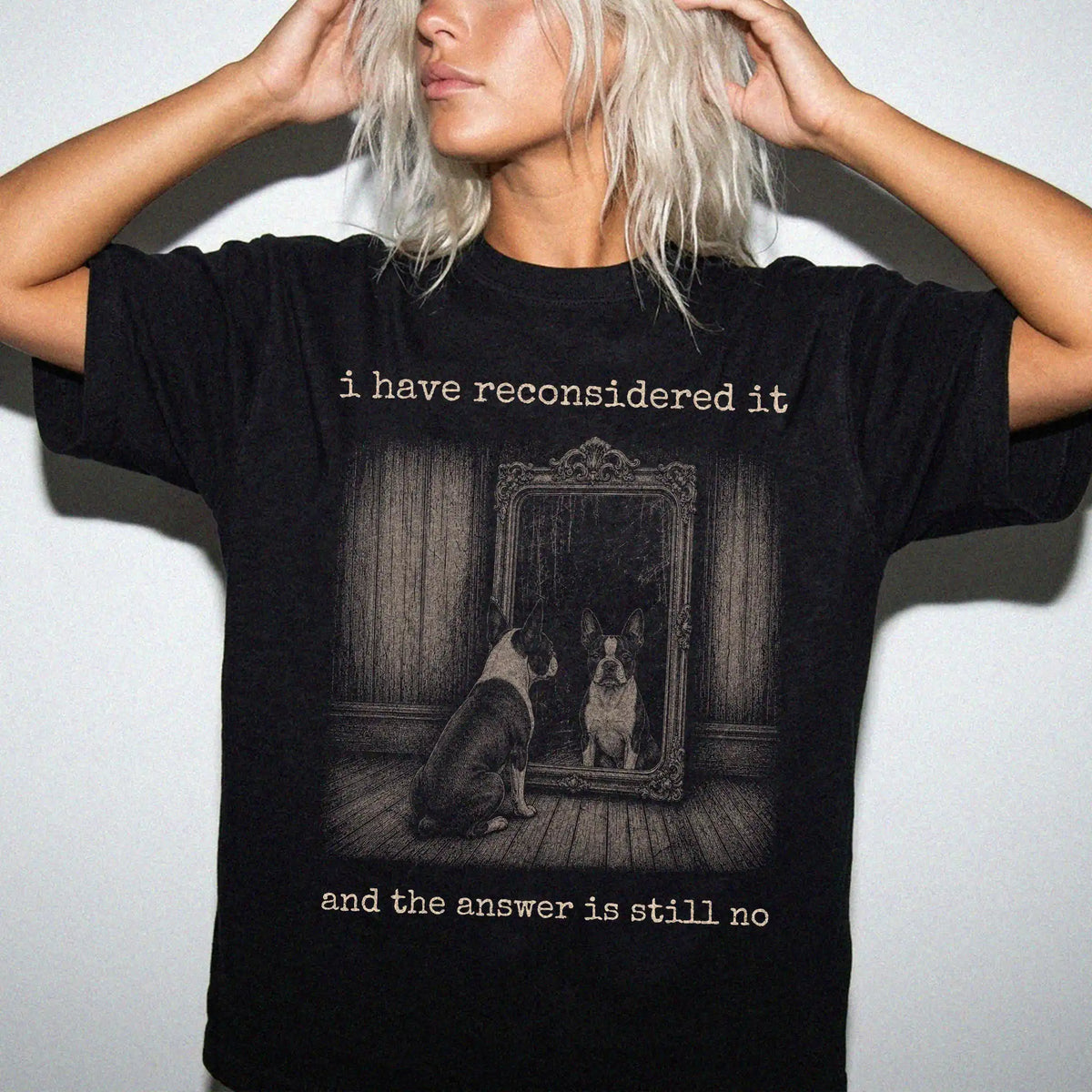 Model wearing a Black Comfort Colors® T-shirt with “the answer is still no” boston terrier design