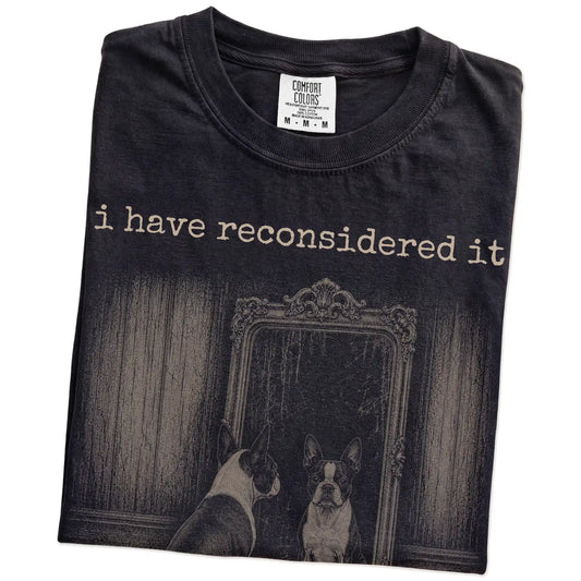 Folded Black Comfort Colors® T-shirt showing “the answer is still no” boston terrier design