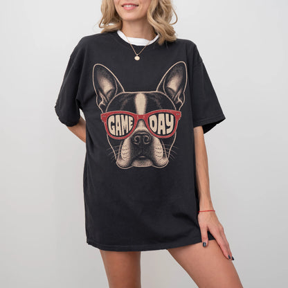 Model wearing a Black Comfort Colors® T-shirt with boston terrier wearing red game day sunglasses