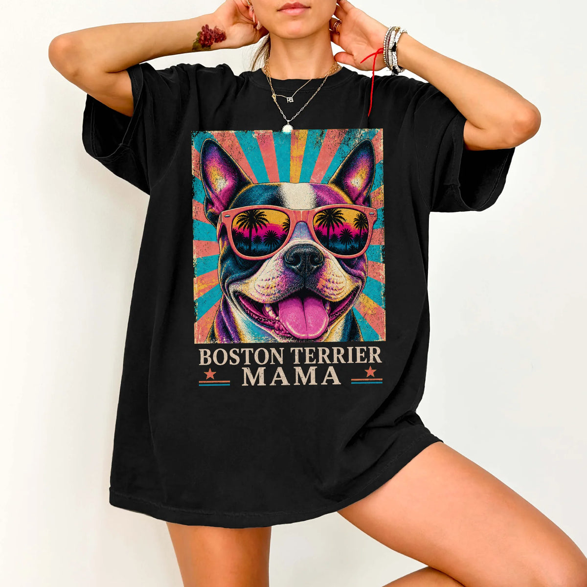 Retro Boston Terrier Mama design on a Black Comfort Colors T-shirt worn by a model