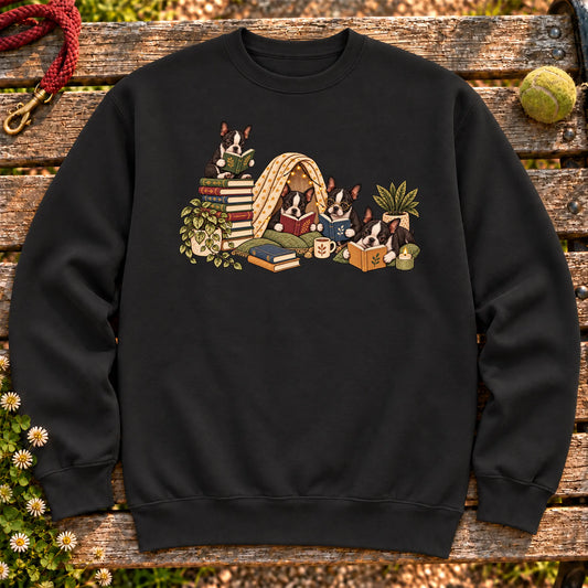 Boston Terrier puppies reading books in a cozy blanket fort on a Black sweatshirt