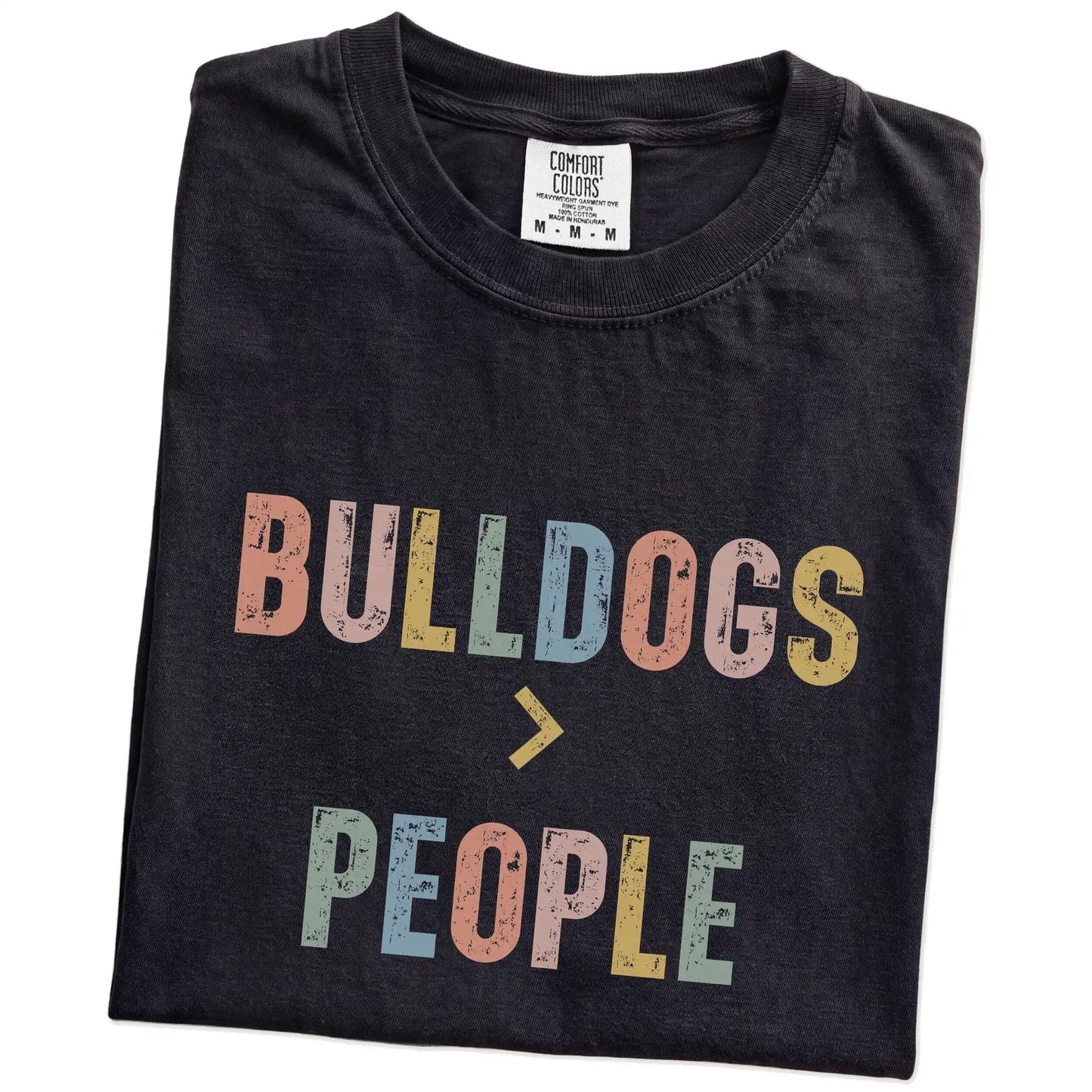 Folded Black Comfort Colors® T-shirt showing “Bulldogs > People” text