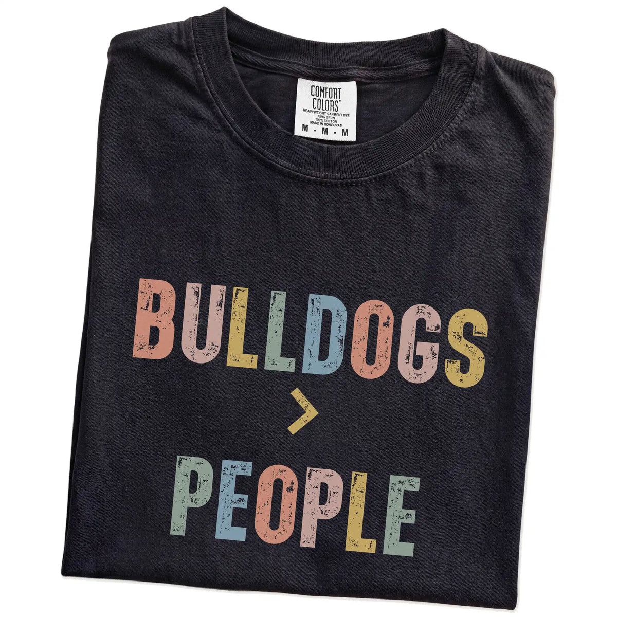 Folded Black Comfort Colors® T-shirt showing “Bulldogs > People” text