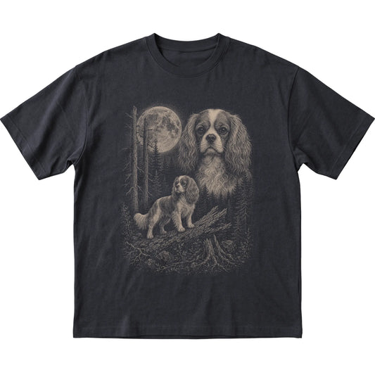 Cavalier King Charles Spaniel Moonlit Forest graphic on a black Softstyle T-shirt laid flat
