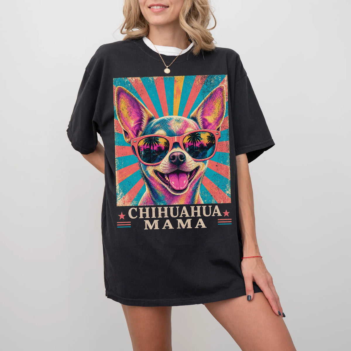 Retro Chihuahua Mama design on a Black Comfort Colors T-shirt worn by a model