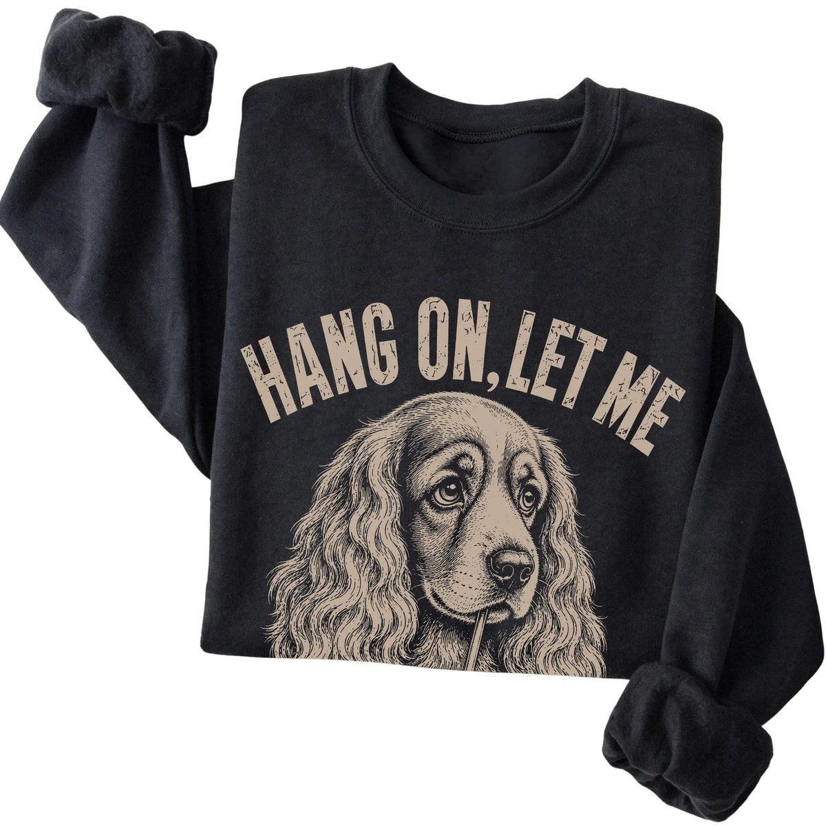 Black crewneck sweatshirt featuring Overthinking Cocker Spaniel, folded presentation