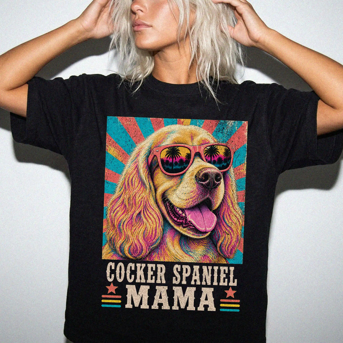 Retro Cocker Spaniel Mama design on a Black Comfort Colors T-shirt worn by a model