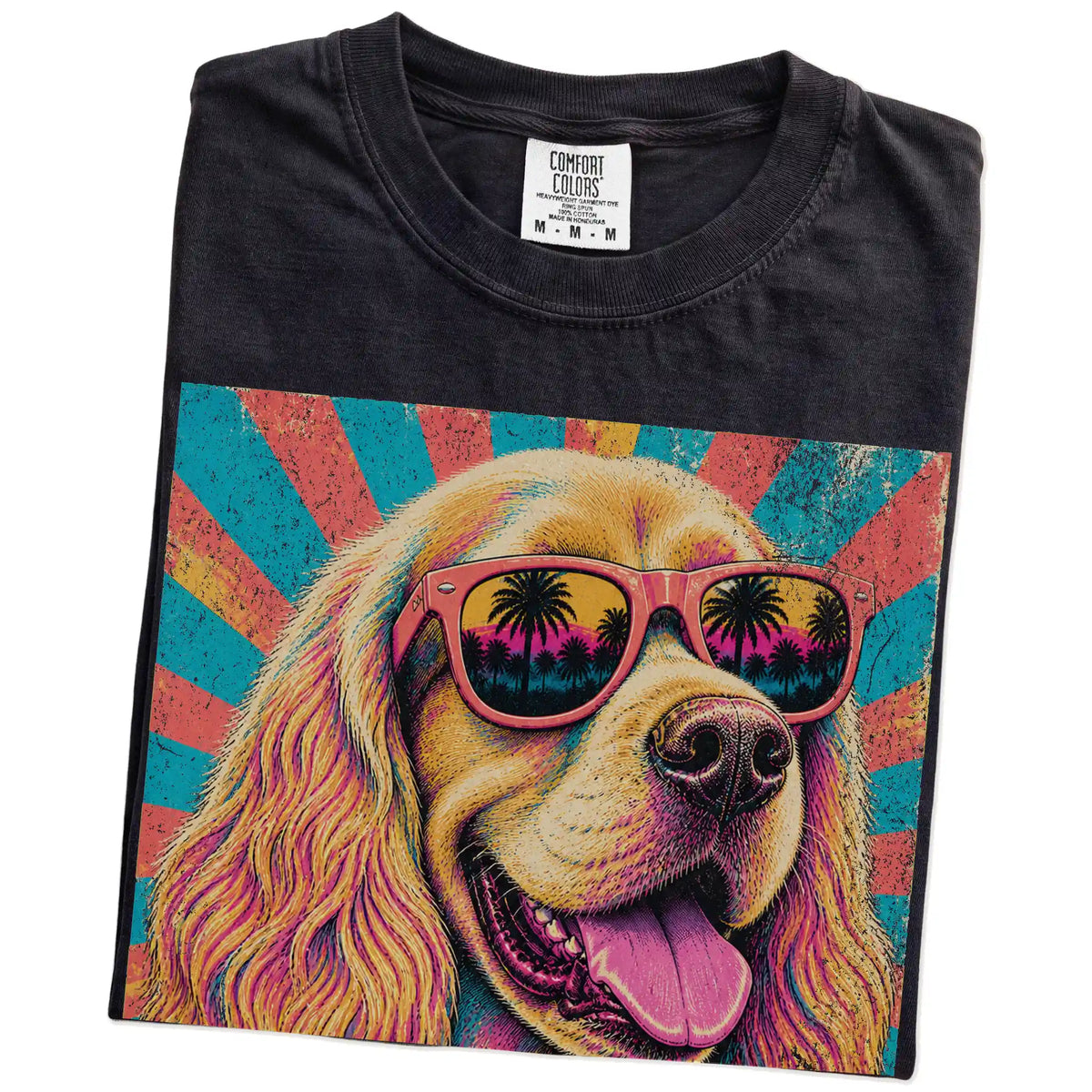 Retro Cocker Spaniel Mama design on a Black Comfort Colors T-shirt folded detail