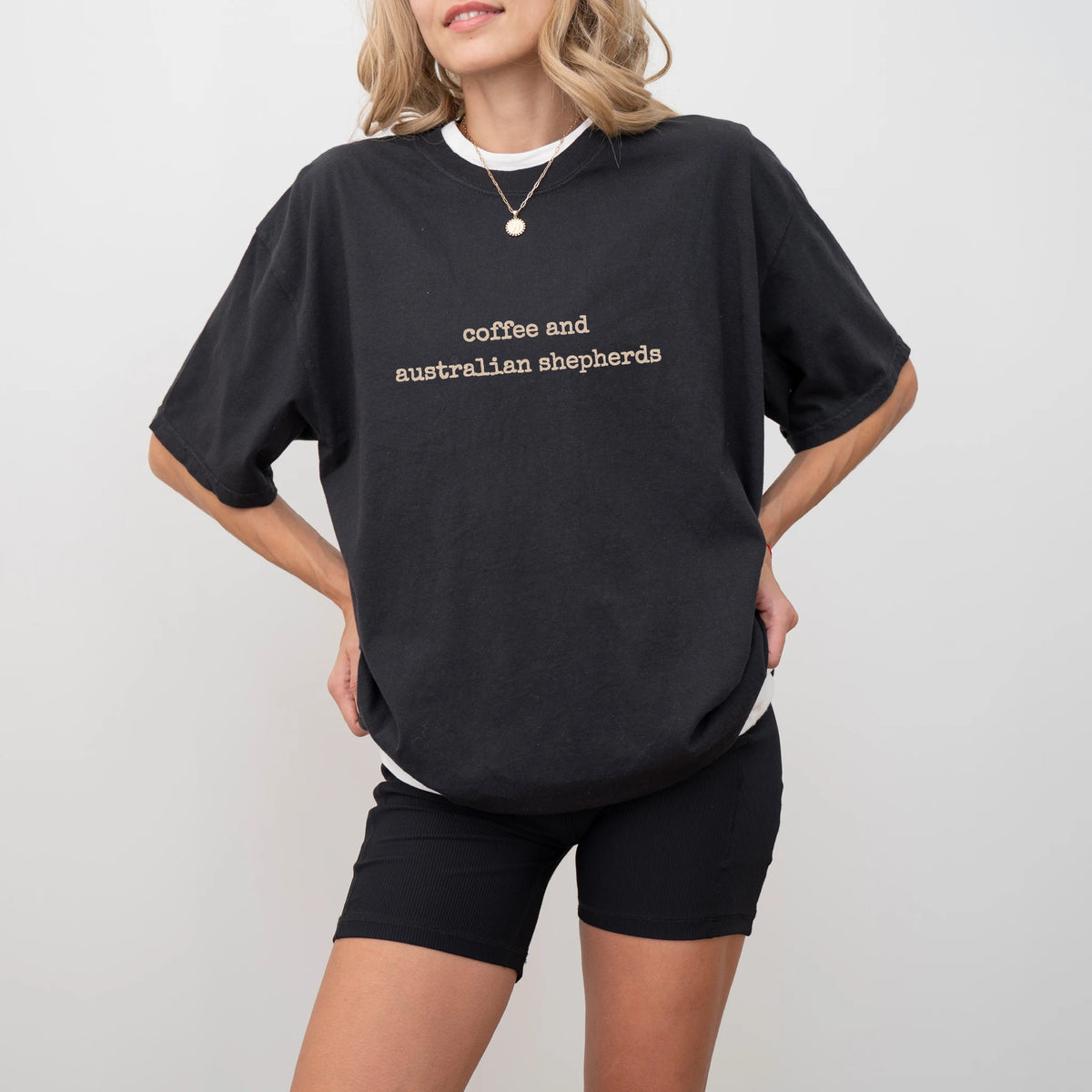 Model wearing a Black Comfort Colors® T-shirt featuring Australian Shepherd coffee saying