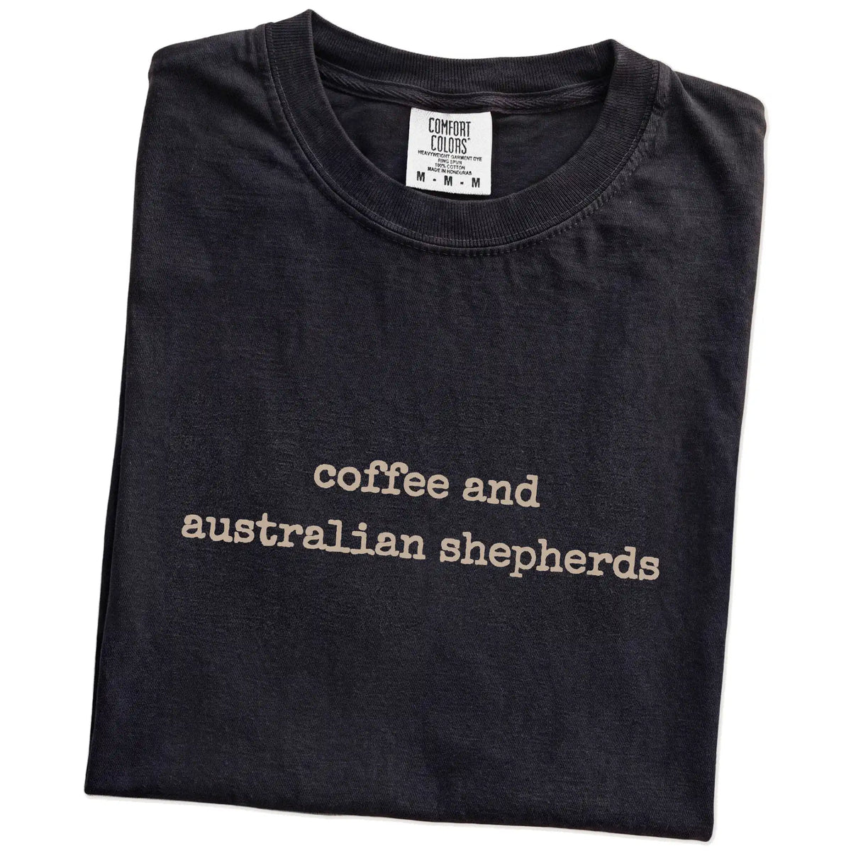 Folded Black Comfort Colors® T-shirt showing Australian Shepherd coffee saying
