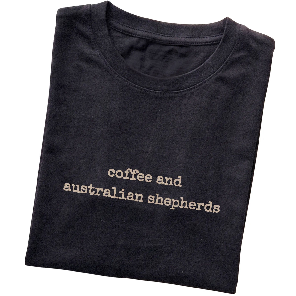 Black Coffee and Australian Shepherds T-shirt folded to show the printed design