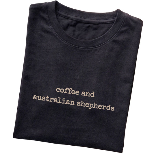 Black Coffee and Australian Shepherds T-shirt folded to show the printed design