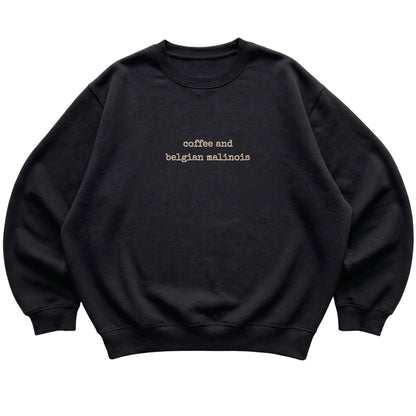 Black Coffee and Belgian Malinois sweatshirt laid flat