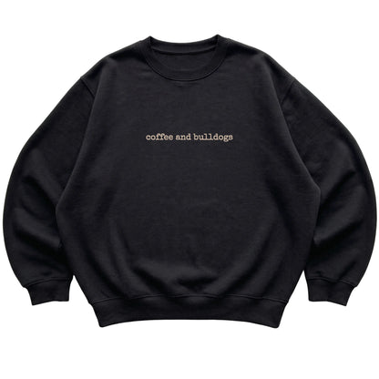 Black Coffee and Bulldogs sweatshirt laid flat