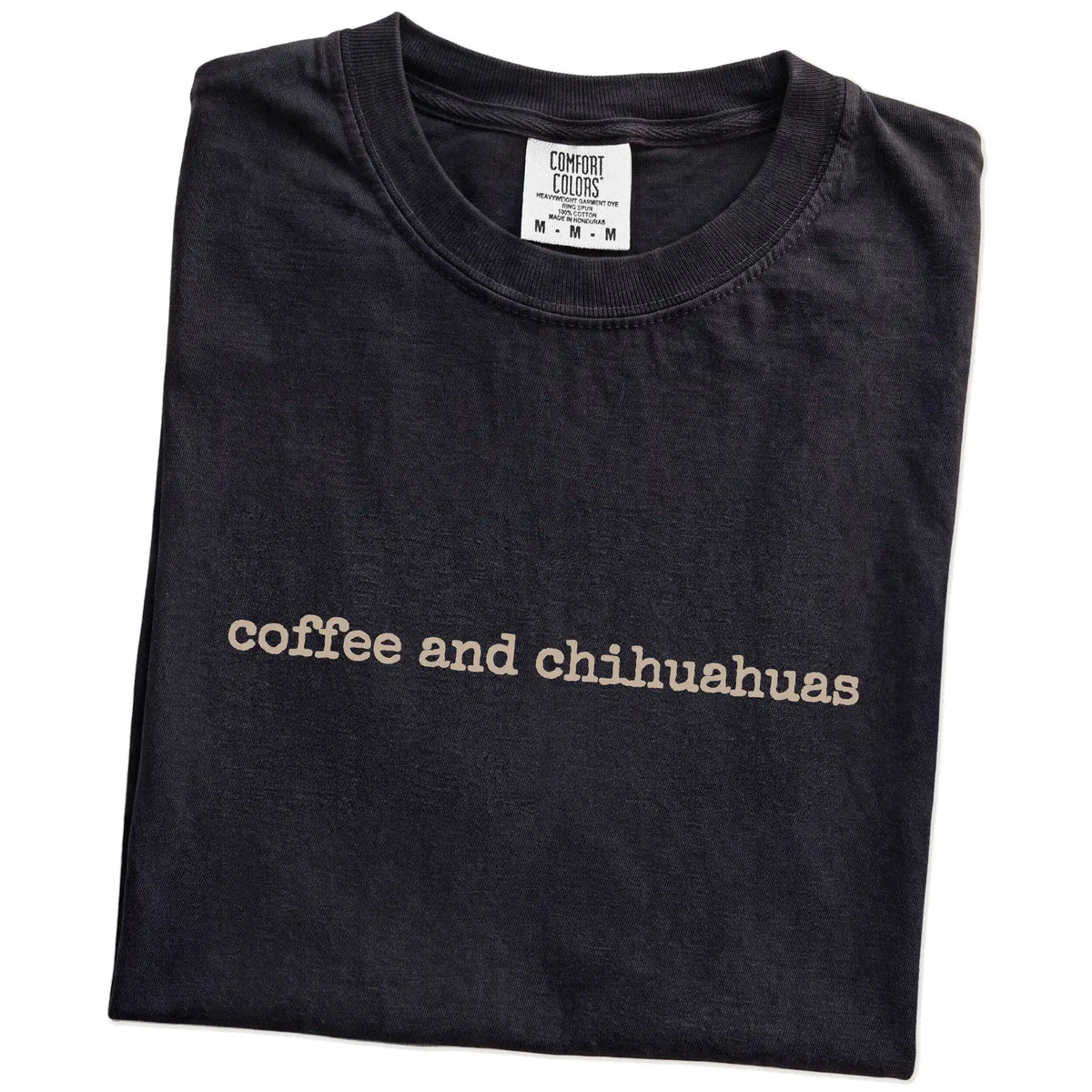 Folded Black Comfort Colors® T-shirt showing “coffee and chihuahuas” retro text