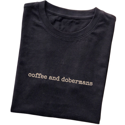 Black Coffee and Dobermans T-shirt folded to show the printed design