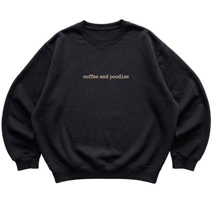 Black Coffee and Poodles sweatshirt laid flat
