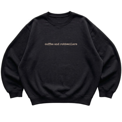 Black Coffee and Rottweilers sweatshirt laid flat