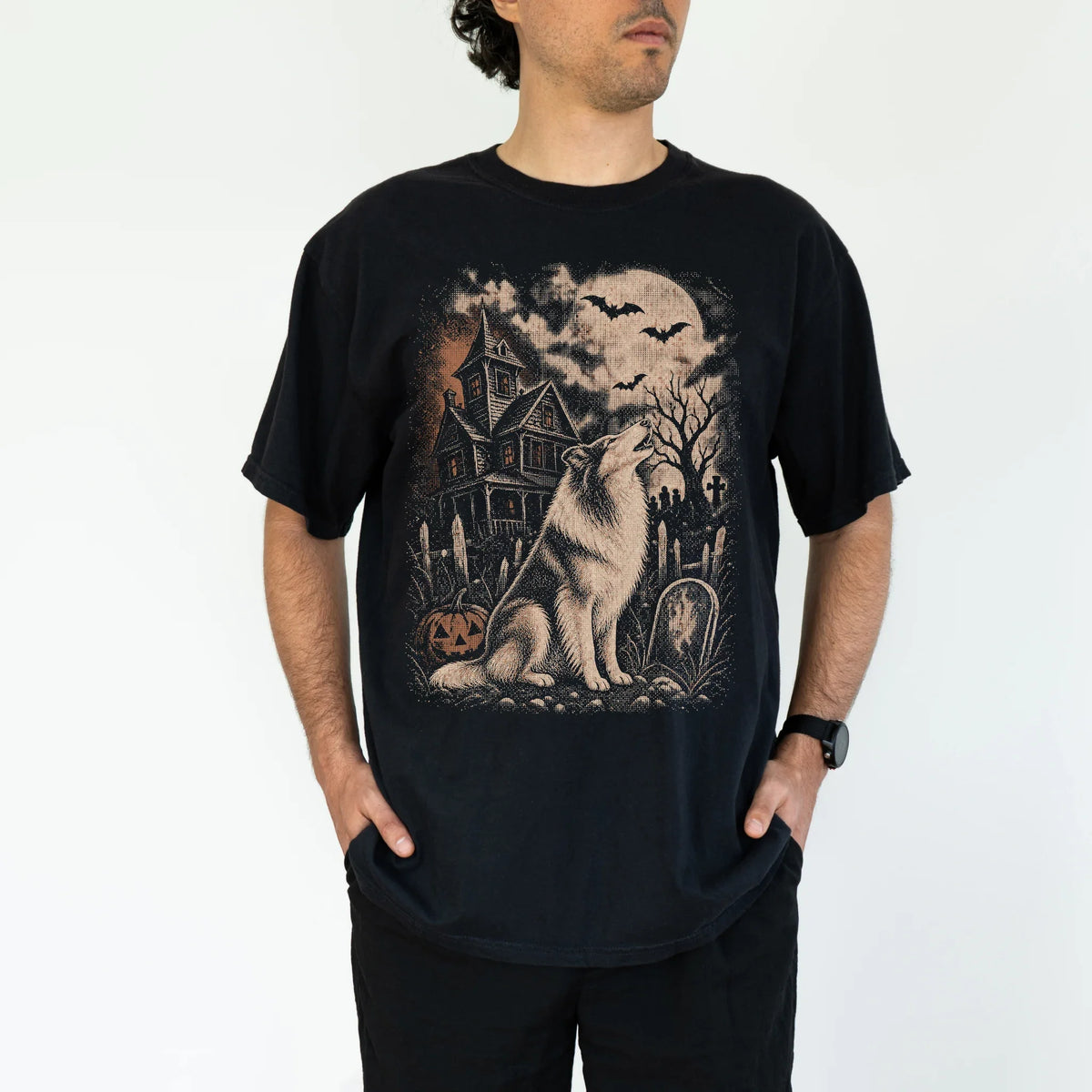 Model wearing a Black Comfort Colors® T-shirt showing Collie in a vintage haunted-house scene