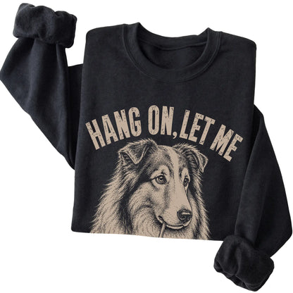 Black crewneck sweatshirt featuring Overthinking Collie, folded presentation