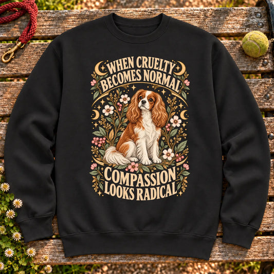 Compassion Looks Radical Cavalier King Charles Spaniel design on a Black Gildan sweatshirt