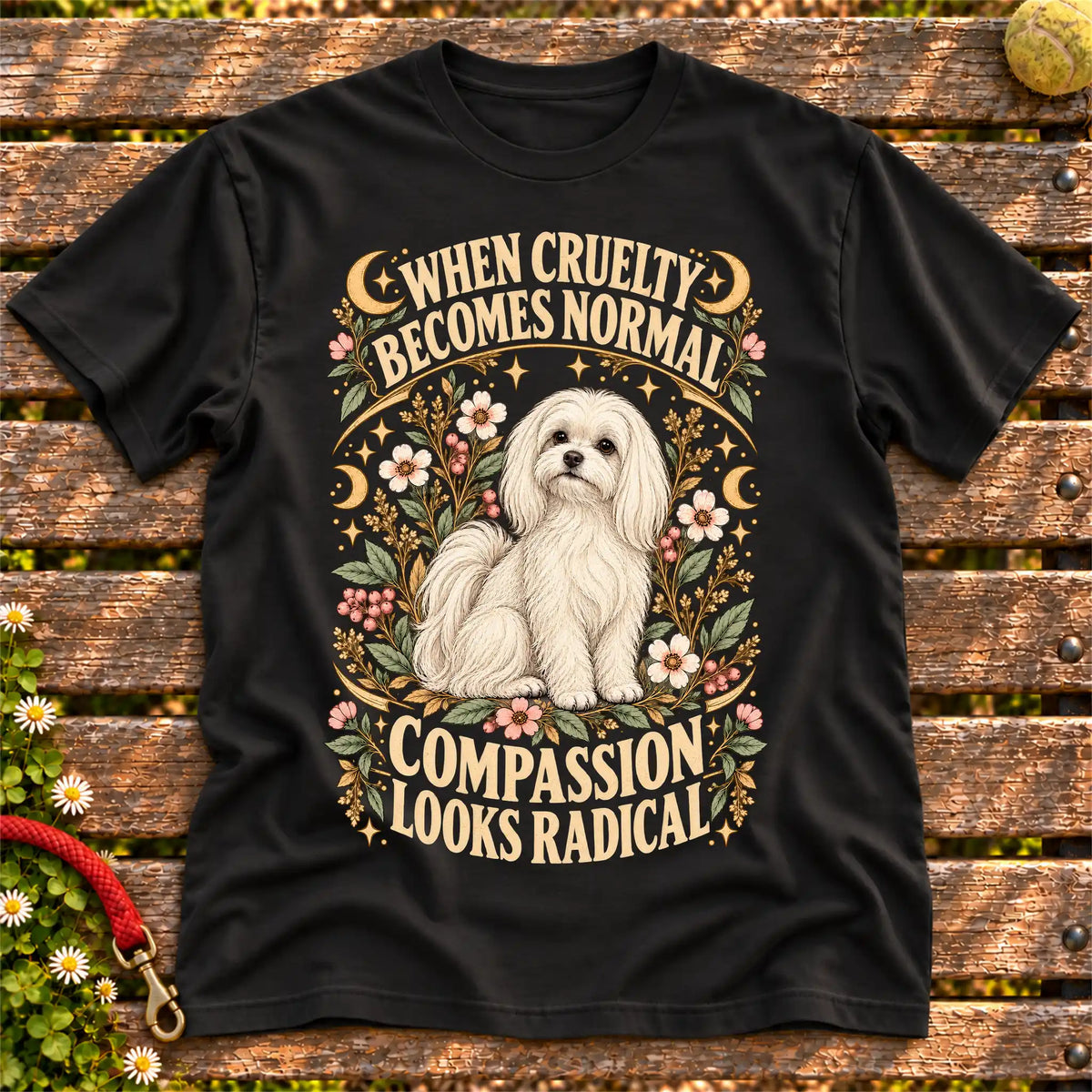 Compassion Looks Radical Maltese design on a Black Gildan T-shirt