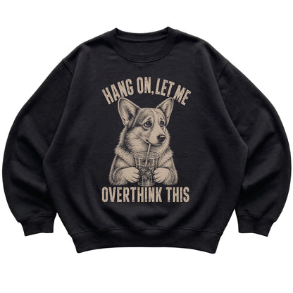 Black crewneck sweatshirt featuring Overthinking Corgi, laid-flat presentation
