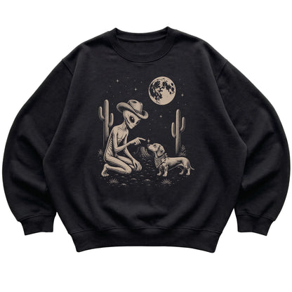 Black crewneck sweatshirt featuring Dachshund Cowboy and Alien, laid-flat presentation