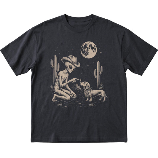 Black T-shirt featuring Dachshund Cowboy and Alien, laid-flat presentation