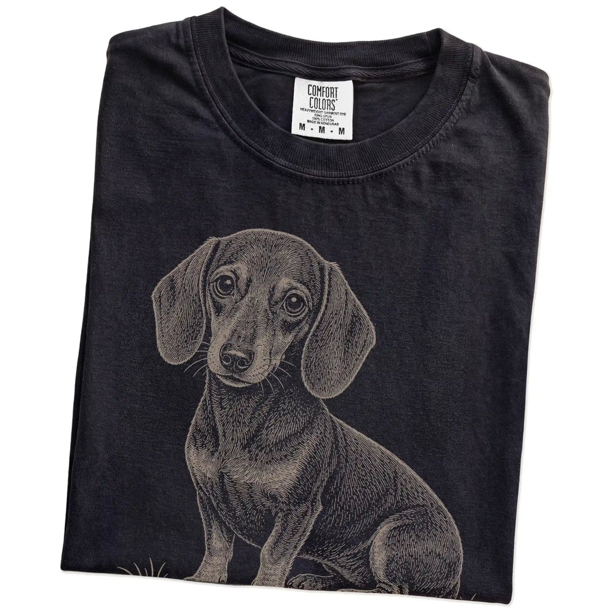 Folded Black Dachshund Karma T-Shirt showing the graphic