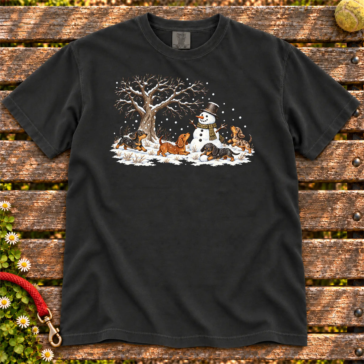 Dachshund puppies playing in snow with a snowman on a Black T-shirt