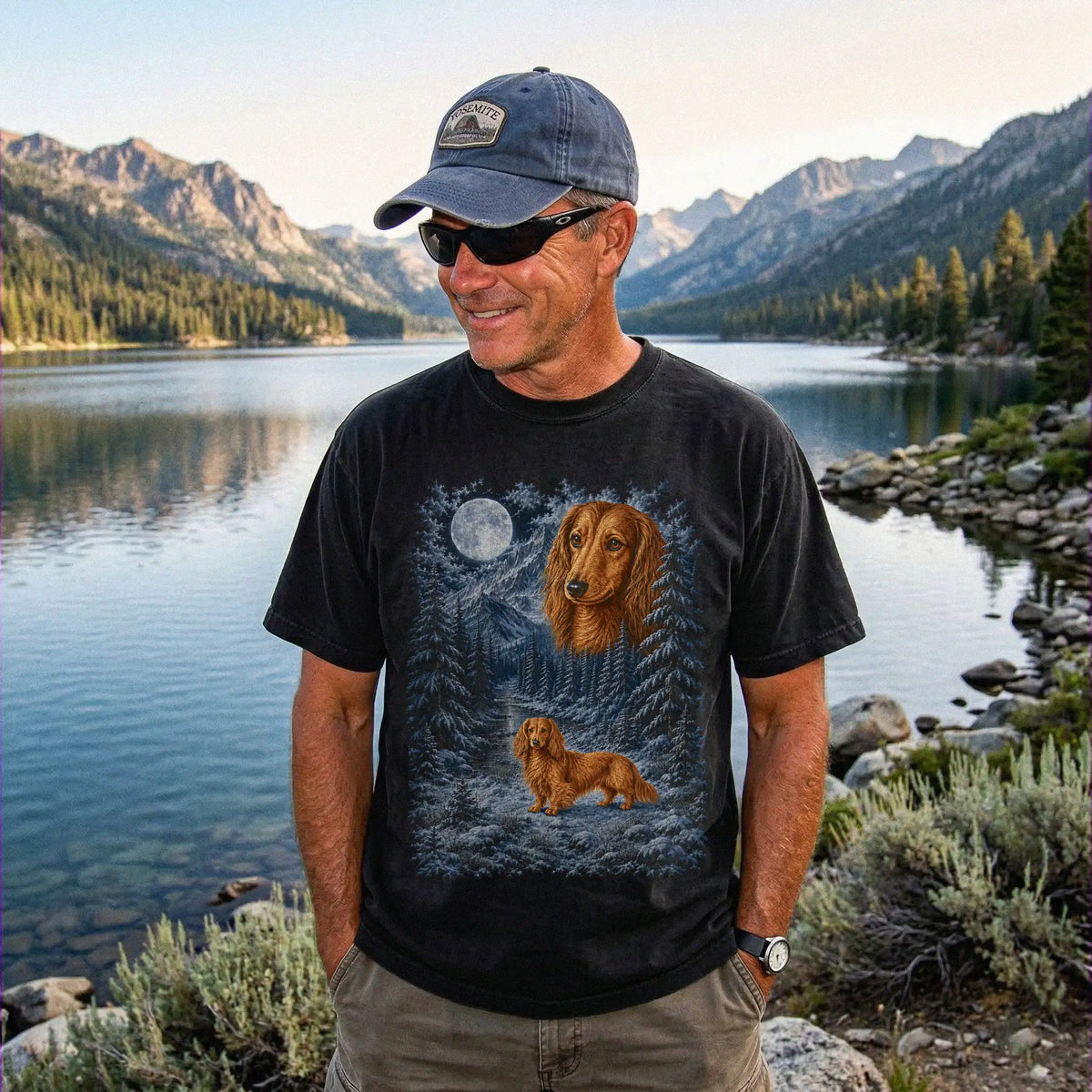 Model wearing a black T-shirt with Dachshund Winter Moon artwork.