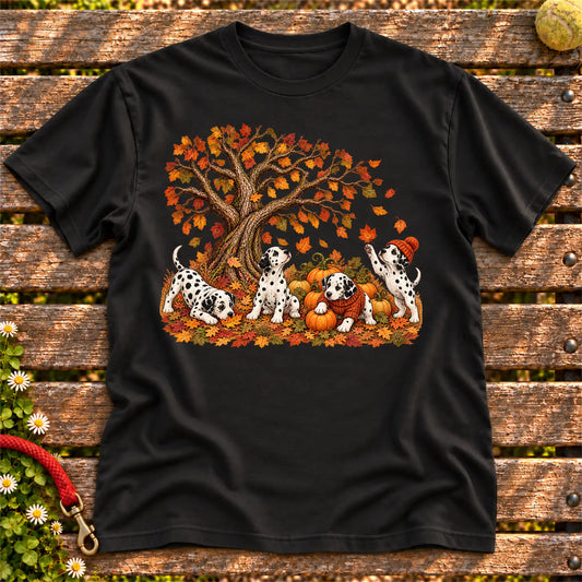 Four Dalmatian puppies with pumpkins beneath an autumn tree on a Black softstyle T-shirt