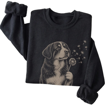 Black crewneck sweatshirt featuring Dandelion Bernese Mountain Dog, folded presentation