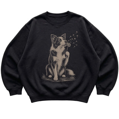 Black crewneck sweatshirt featuring Dandelion Border Collie, laid-flat presentation