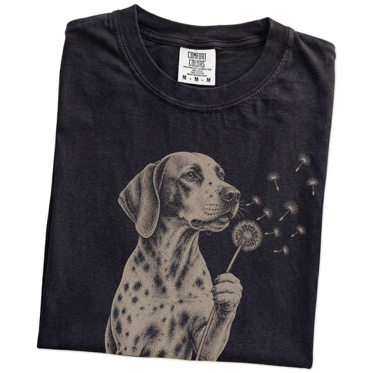 Folded Black Comfort Colors® T-shirt showing Pointer portrait with drifting dandelion seeds