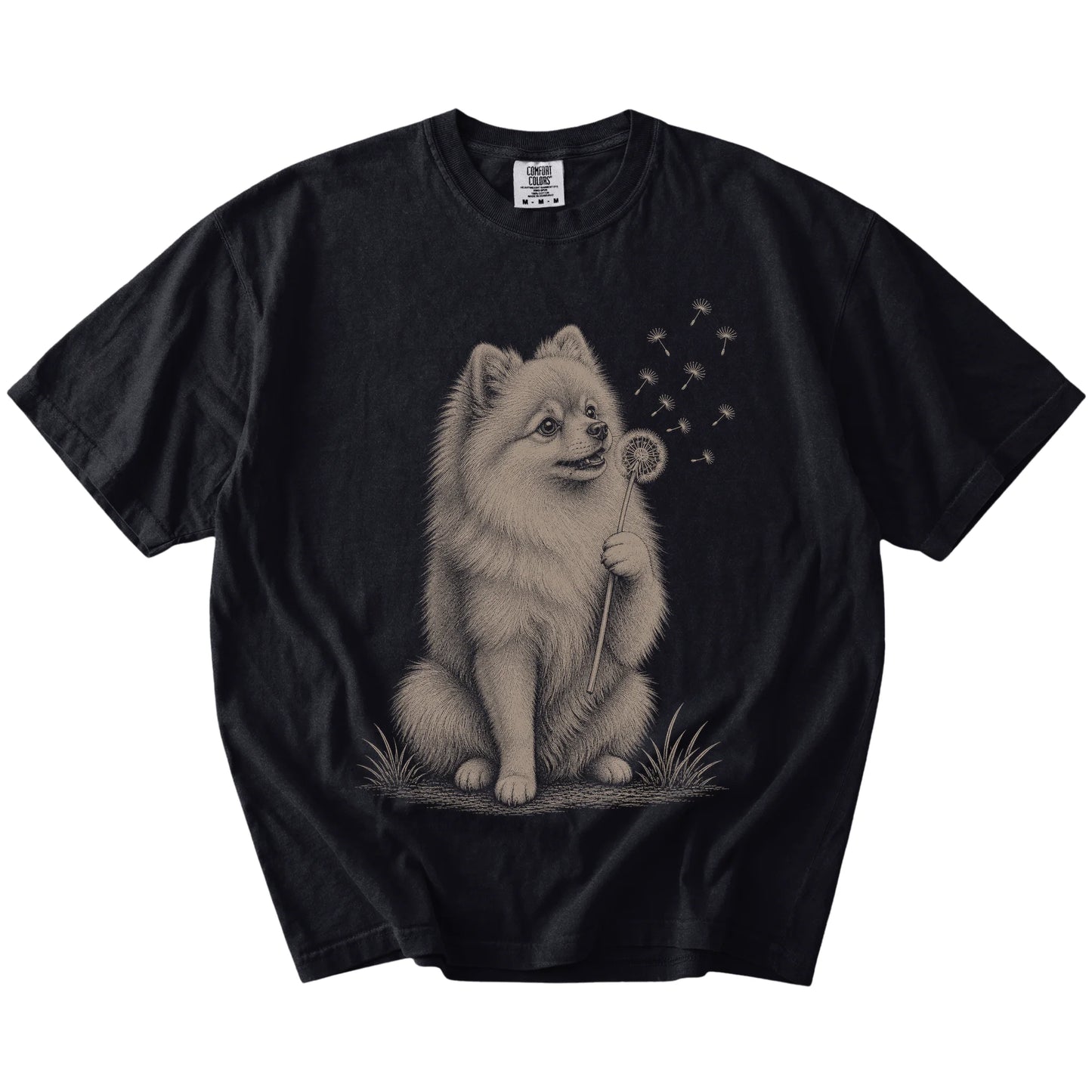 Pomeranian portrait with drifting dandelion seeds on a Black Comfort Colors® T-shirt