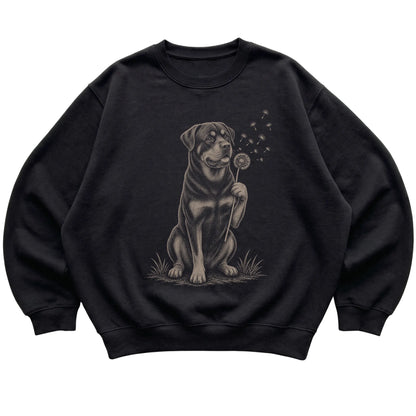 Black crewneck sweatshirt featuring Dandelion Rottweiler, laid-flat presentation